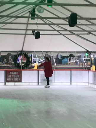 Me in skates at the slushy outdoor rink.